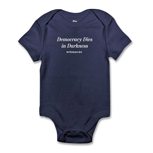 navy baby onsie with "democracy dies in darkness" and washington post logo in white 