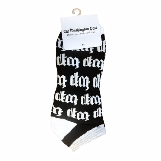 Black crew socks with "wp" pattern in white lettering, white heel, toe, and ankle.