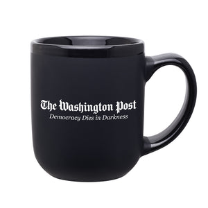 Black mug. In the middle of the hug is The Washington Post and Demoracy Dies in Darkness in white text.
